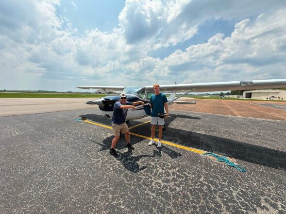 Blackstone Aviation instructor and student celebrating on the ramp