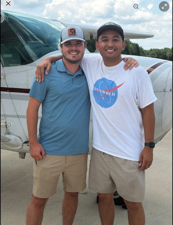 Blackstone Aviation instructor congratulating a student on passing his Private Pilot checkride